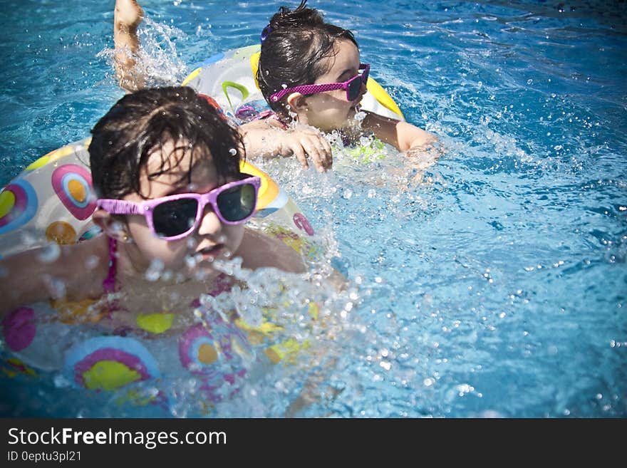 2 Girl&#x27;s Swimming during Daytime