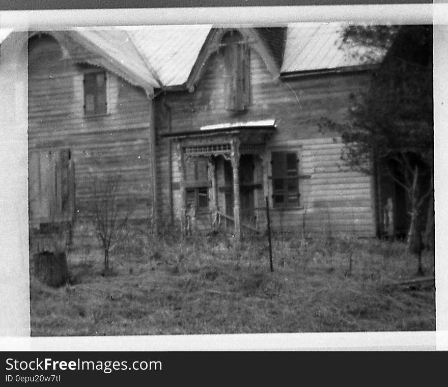 Exterior of old wooden house in Belleville circa 1970 in black and white. Exterior of old wooden house in Belleville circa 1970 in black and white.