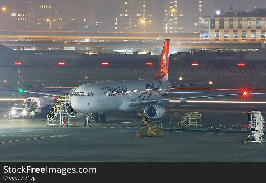 Commercial jet on apron of airport at night. Commercial jet on apron of airport at night.