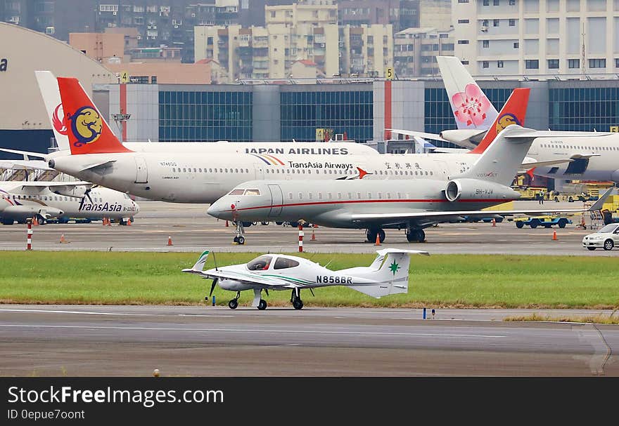 Commercial airliners on runway at international airport. Commercial airliners on runway at international airport.