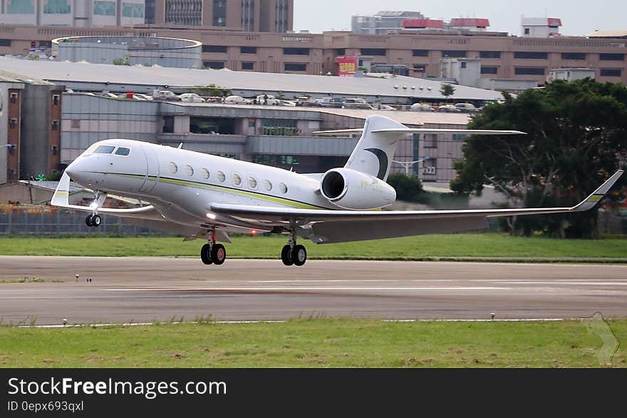 Private jet on take off on airport runway.