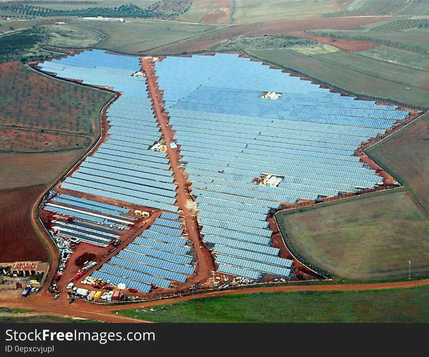 Aerial view over large field of solar panels in countryside. Aerial view over large field of solar panels in countryside.