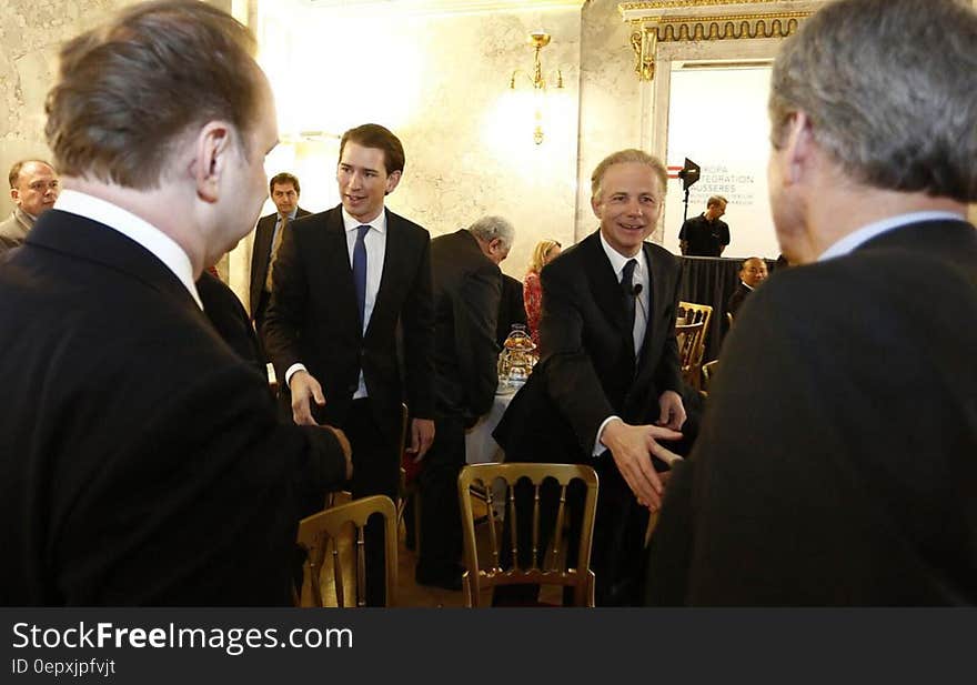 Business men meeting and greeting inside room. Business men meeting and greeting inside room.