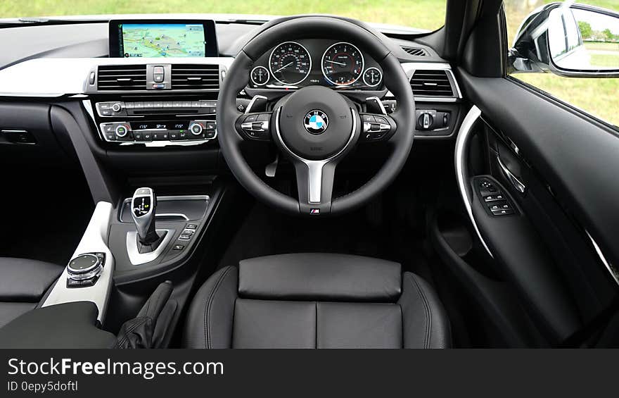 Leather interior of luxury BMW car on sunny day. Leather interior of luxury BMW car on sunny day.