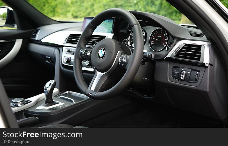 Interior of luxury BMW automobile on sunny day. Interior of luxury BMW automobile on sunny day.