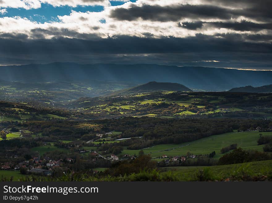 Aerial View of Green Field With Sunlight during Daytime