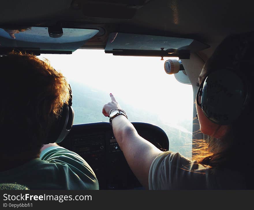 Persons on Aircraft Pointing on View during Daytime