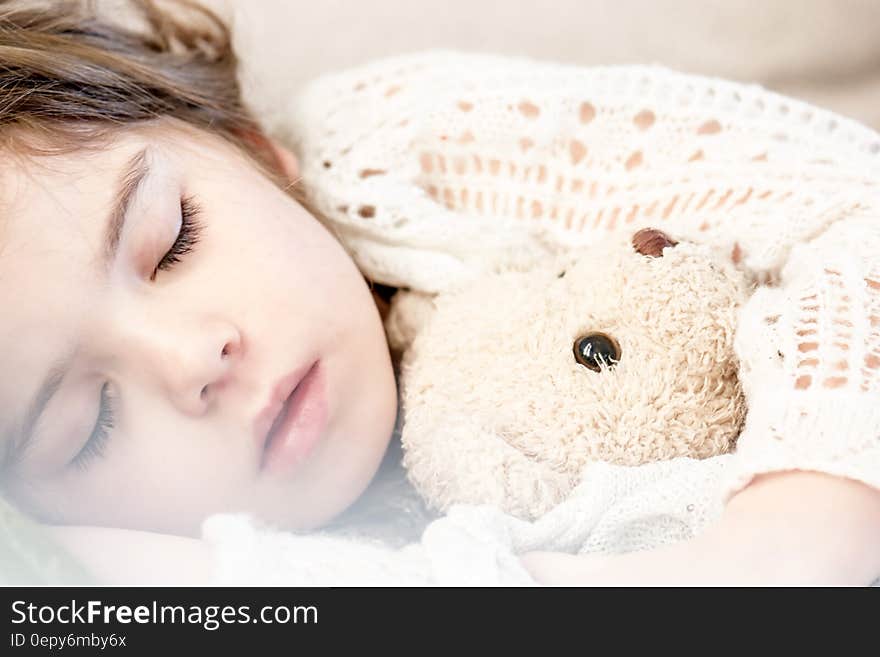 Girl Sleeping With Her Brown Plush Toy