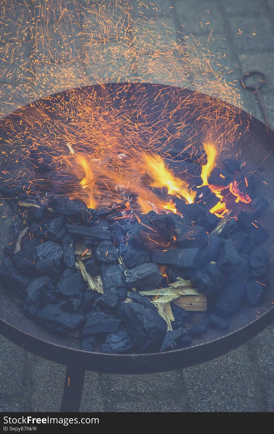 Black Charcoal With Fire on Black Round Steel Bowl