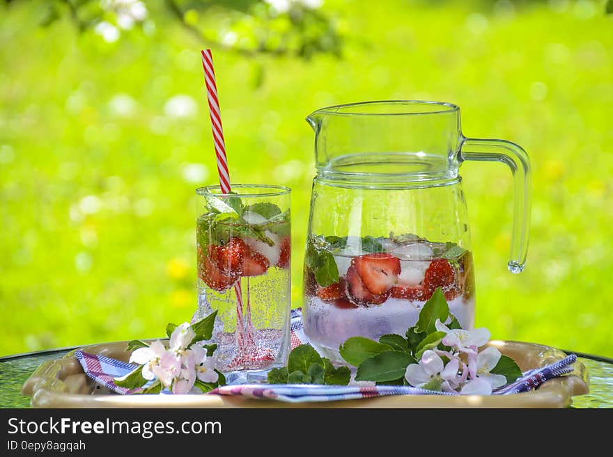 Clear Glass Pitcher With Water and Strawberry