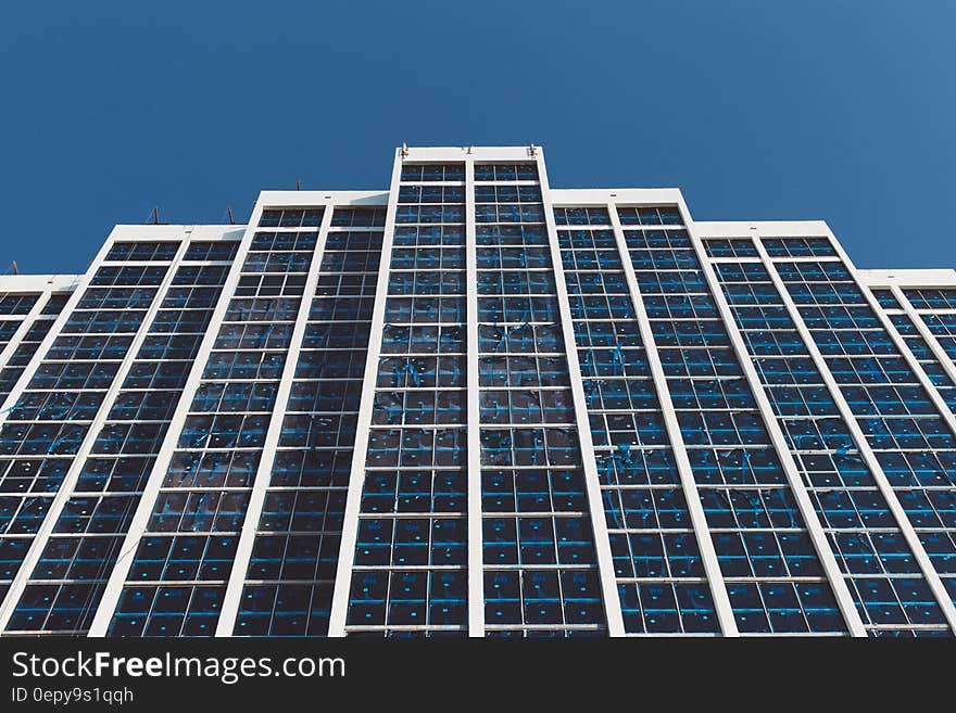 White and Blue High Rise Building Under Blue Sky during Daytime