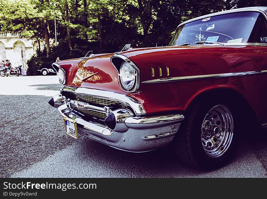 Red and Gray Vintage Car on Gray Concrete Road during Daytime