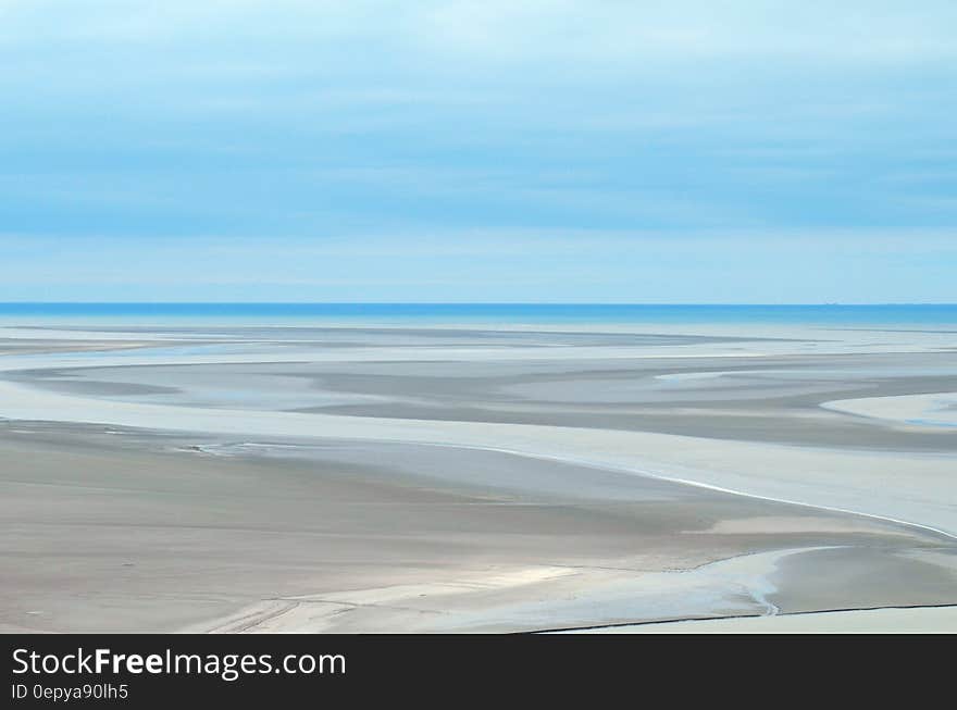 Gray Sand Dunes Under Blue Sky