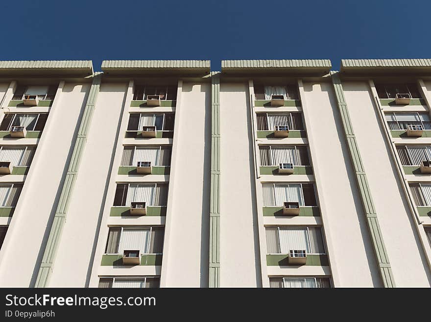 White Painted Residential Building Under Clear Skies