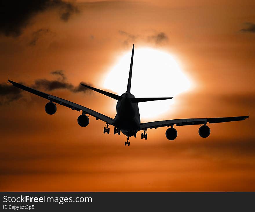 Shadow Image of a Plane Flying during Sunset