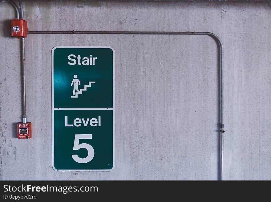 Green and White Stair Level 5 Signage