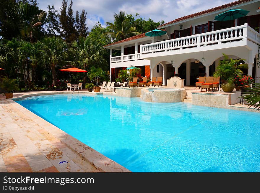 Red Outdoor Chair Near in Swimming Pool