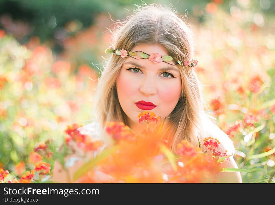 Woman in Flower Field Wearing Headband