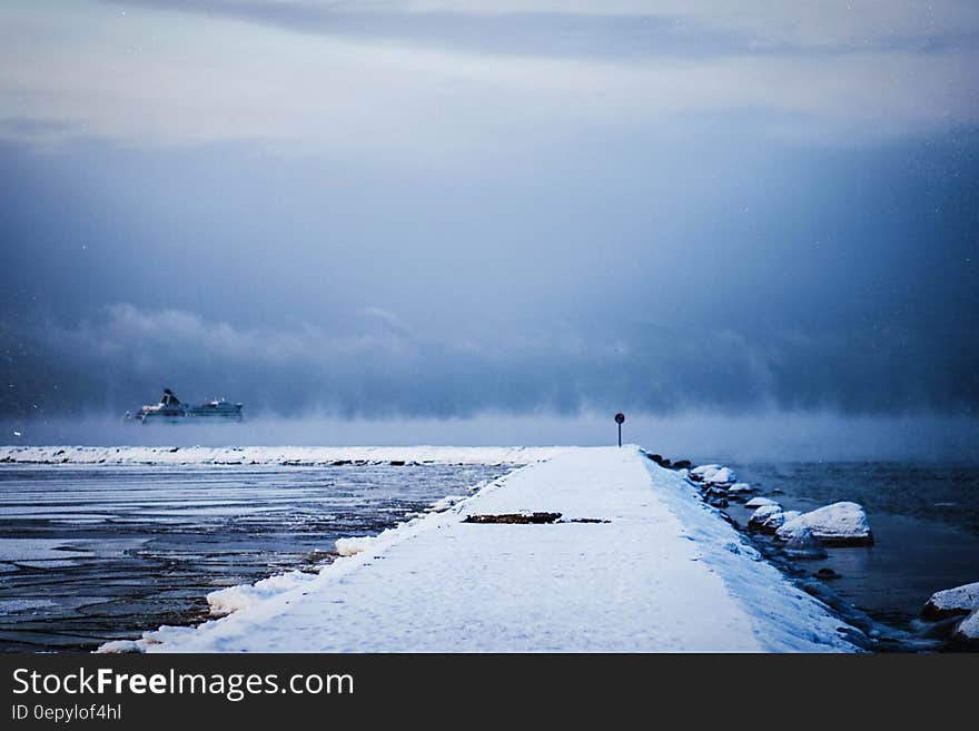 White Dock Covered by White Snow