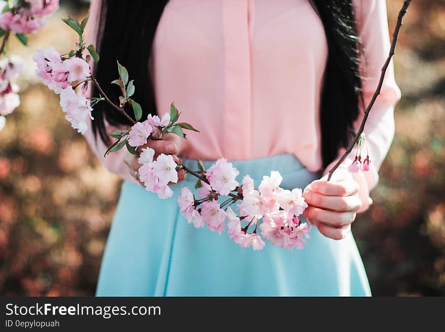 Woman Holding Pink Flowers