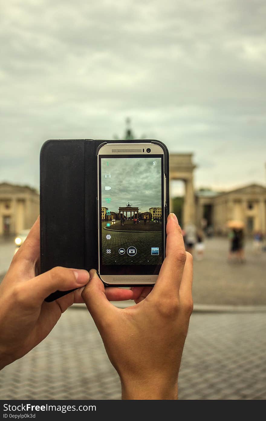 Person Taking Picture Using Gray Smartphone