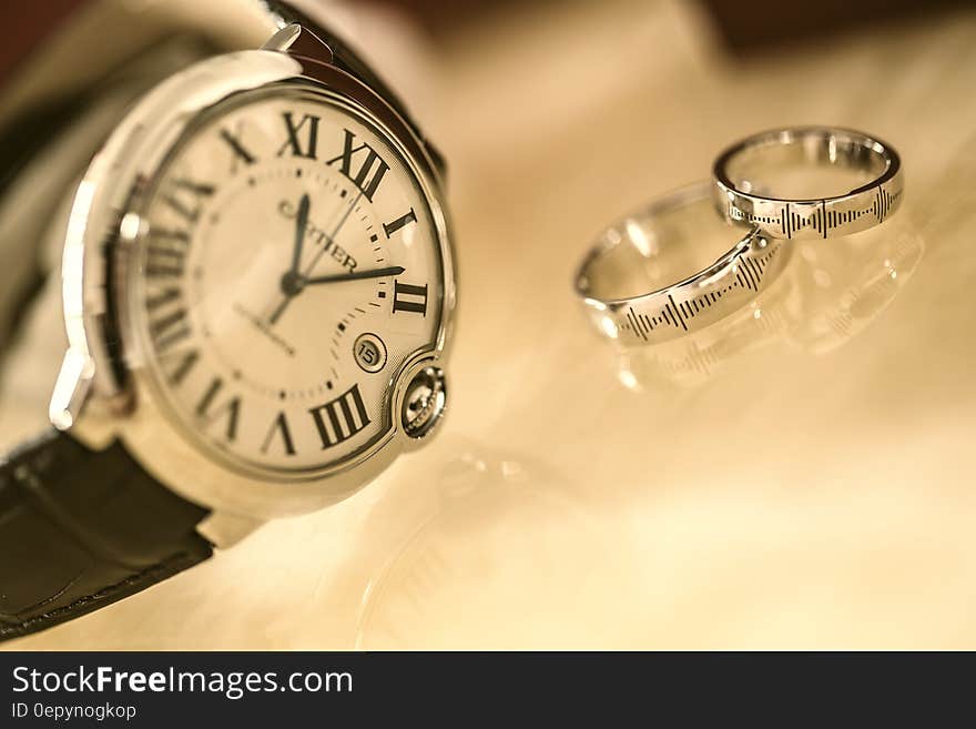 Silver Wedding Rings Near Silver Round Analog Watch