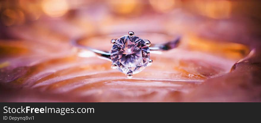 Close Up Photo of Grey and Diamond Ring