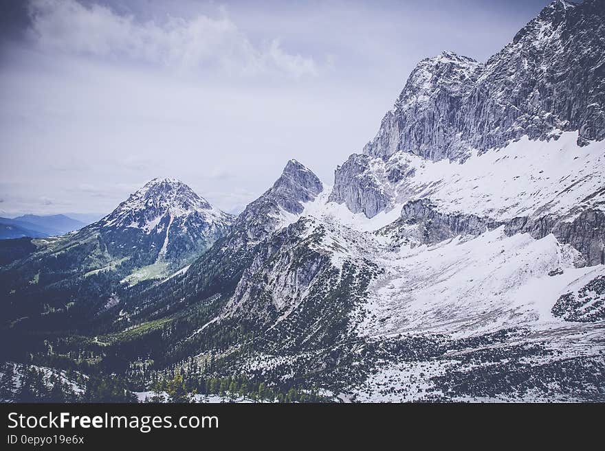 Snow on Gray Black Mountain Range