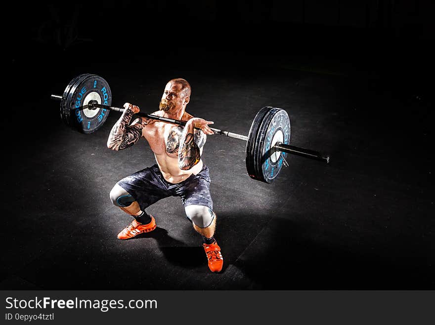 Man Lifting a Barbell