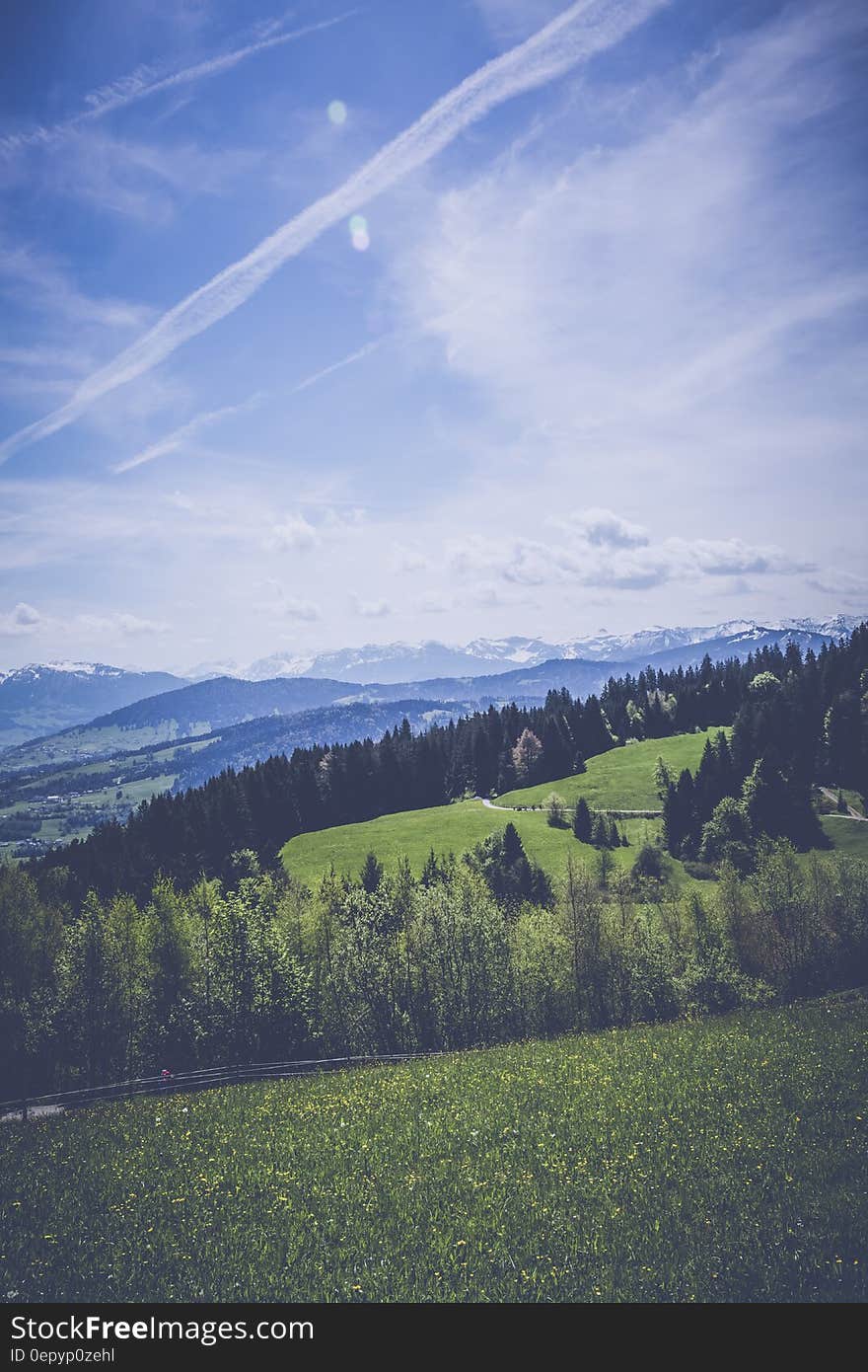 Landscape Photography of Green Grass Field Mountain