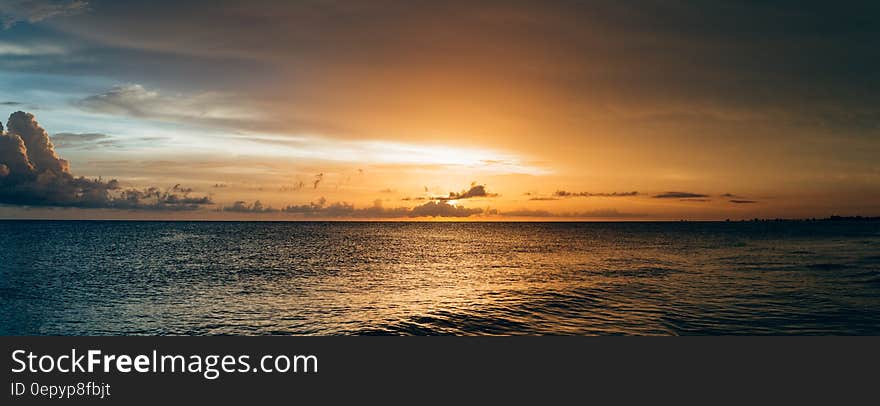 Scenery of Sea Water during Sunset