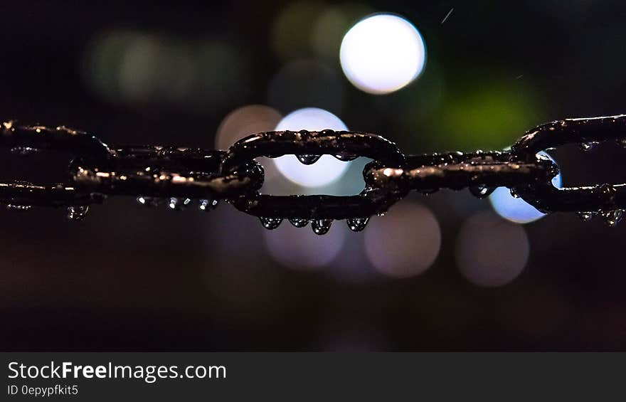 Selective Focus Photo of Black Metal Chain