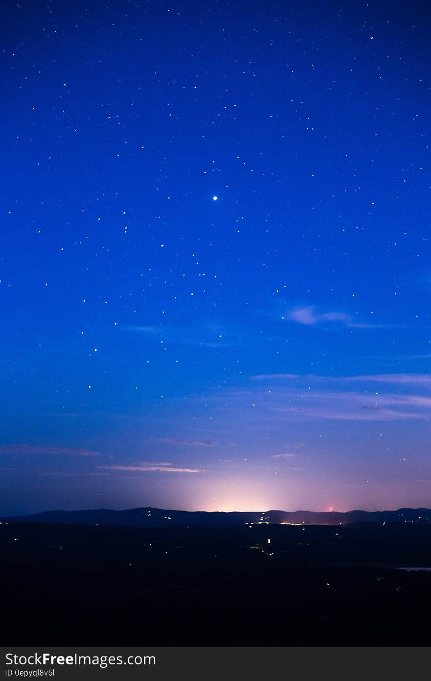 Silhouette of Mountain Range Under Stars