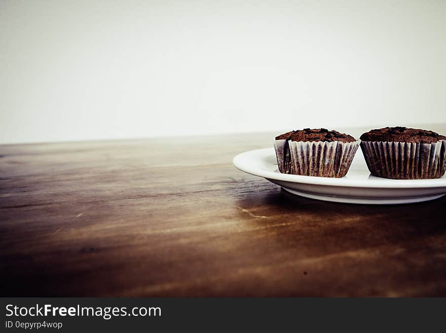 Brown Cupcake on White Ceramic Plate