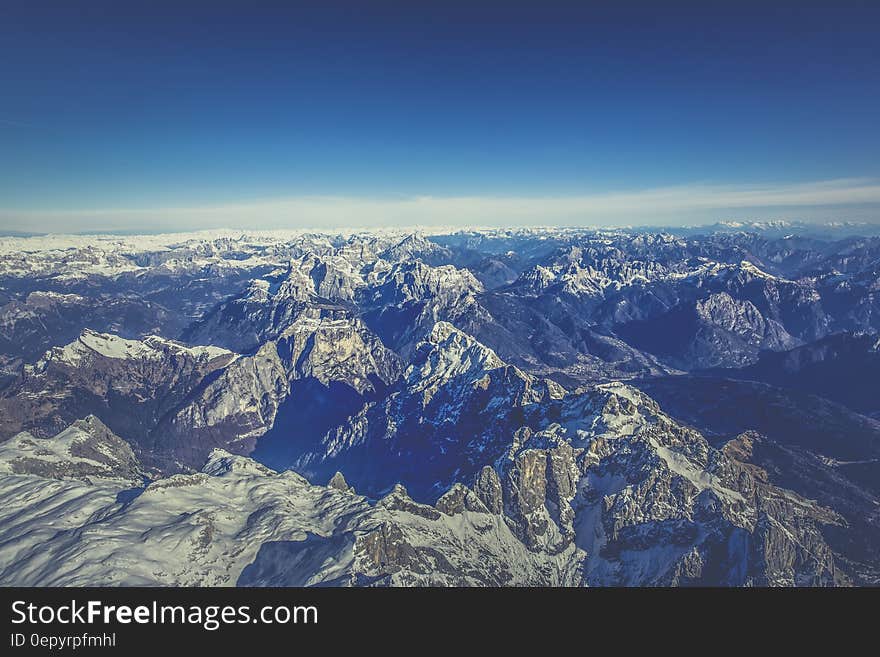 Aerial View of Mountain Under Blue Sky during Day Time