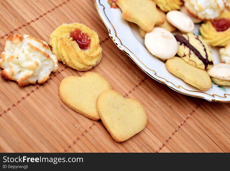 Close up of Christmas cookies on china plate and bamboo mat. Close up of Christmas cookies on china plate and bamboo mat.