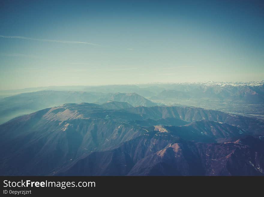 Aerial Photography of Mountain Under Sunny Blue Sky