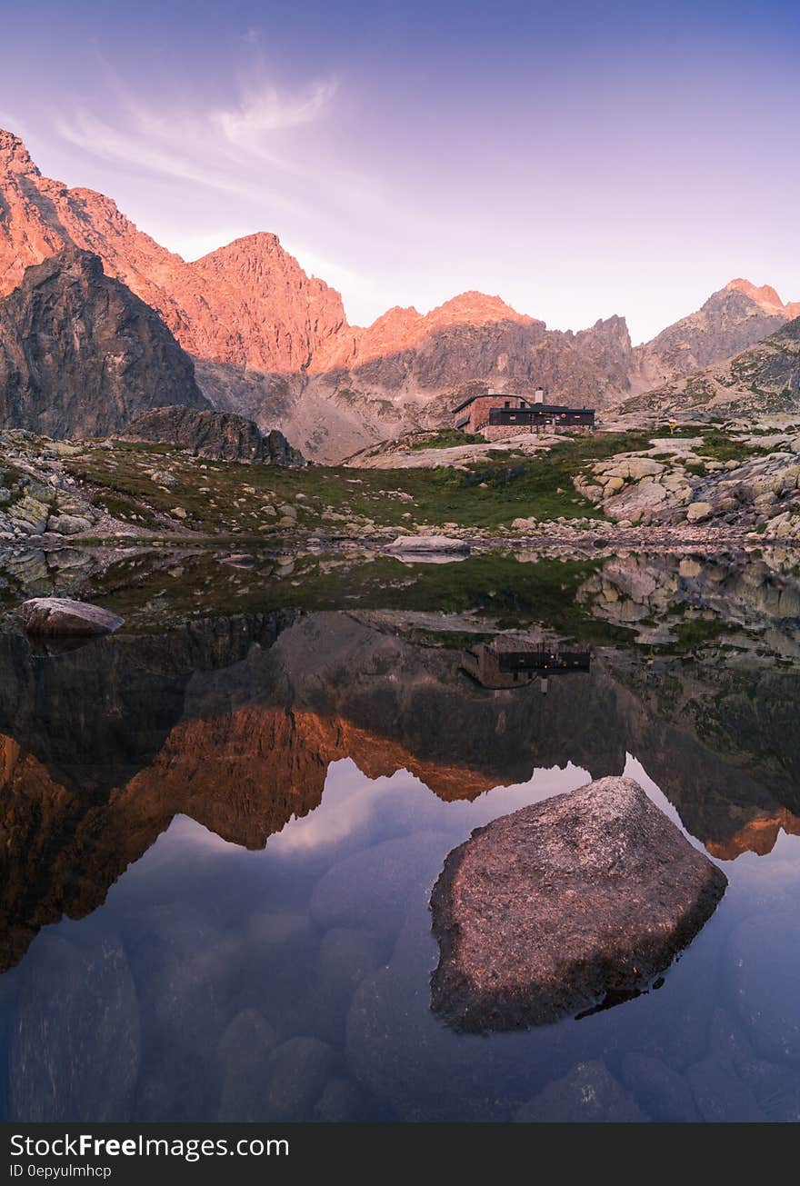 Mountain peaks reflecting in alpine lake in Slovakia on sunny day. Mountain peaks reflecting in alpine lake in Slovakia on sunny day.