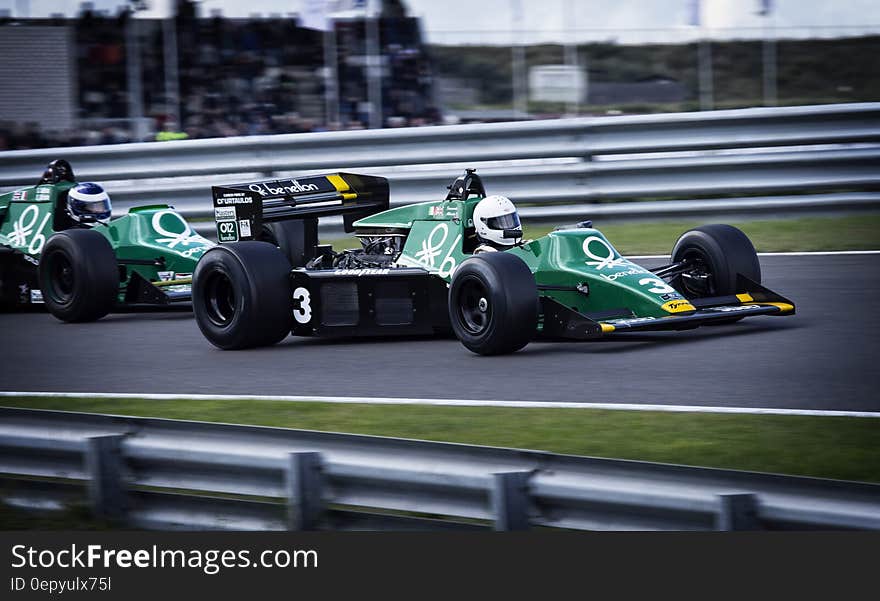 Race cars on track of Formula 1 motor speedway in competition. Race cars on track of Formula 1 motor speedway in competition.