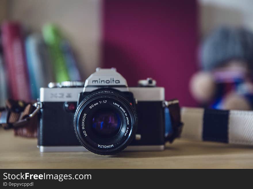 Gray and Black Classic Camera on Beige Table