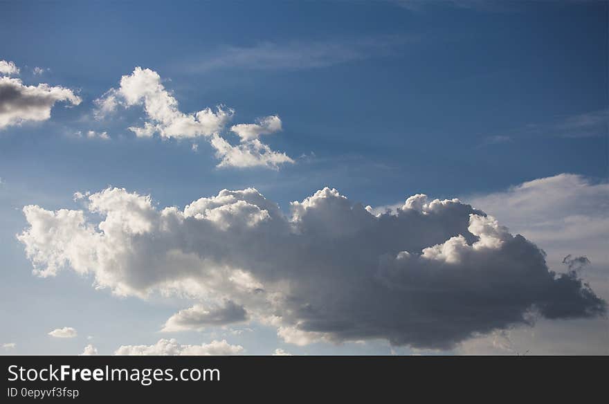 White clouds in blue skies on sunny day.