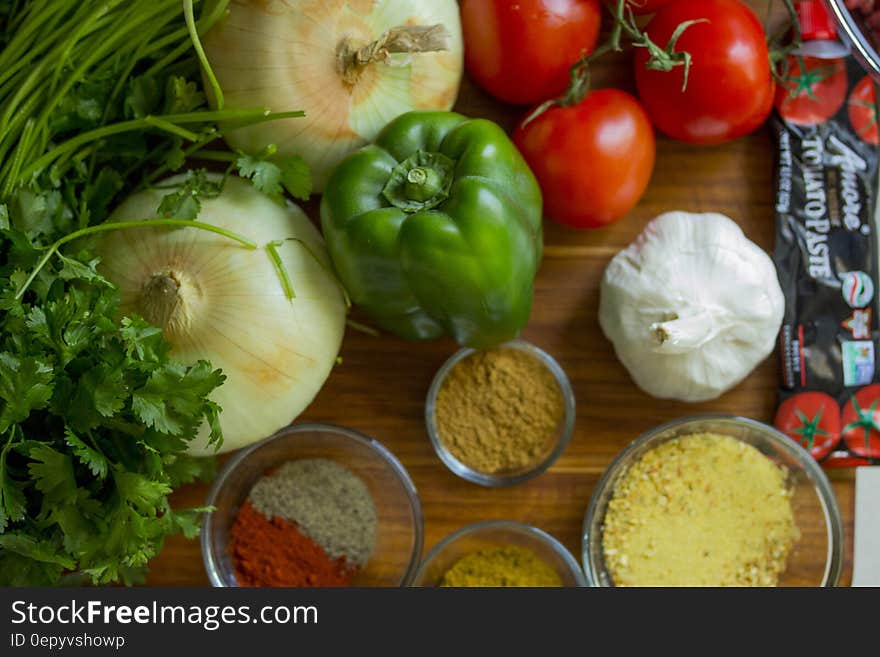 Fresh vegetables and spices on wooden cutting board. Fresh vegetables and spices on wooden cutting board.