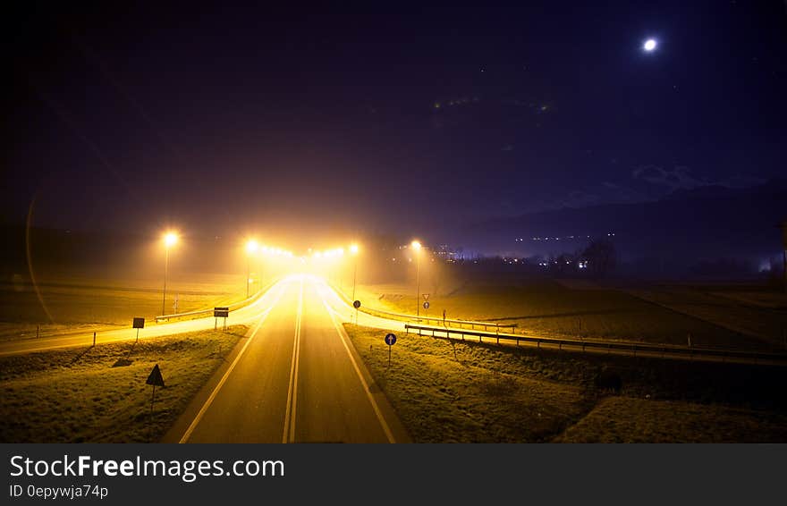 Illuminated roadway with ramps empty at night. Illuminated roadway with ramps empty at night.