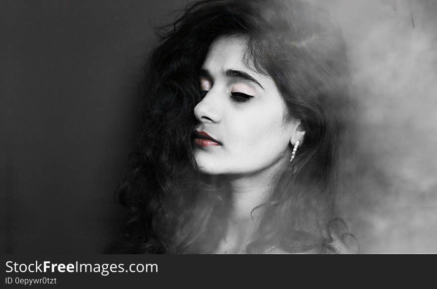 Grayscale Photography of Woman With Red Lipstick Wearing Hoop Earrings