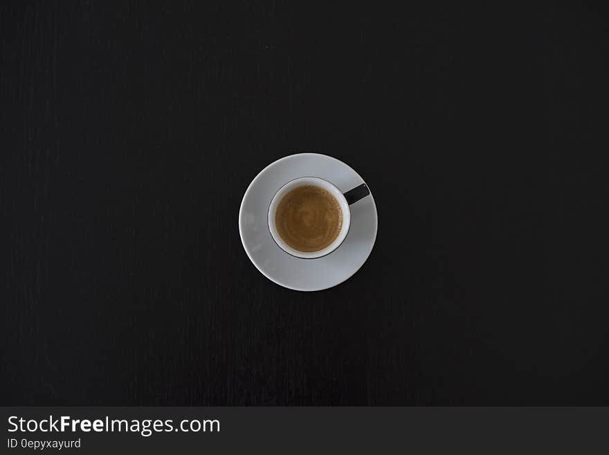 White Ceramic Coffee Cup on White Saucer