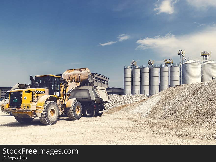 Industrial truck at gravel quarry on sunny day. Industrial truck at gravel quarry on sunny day.