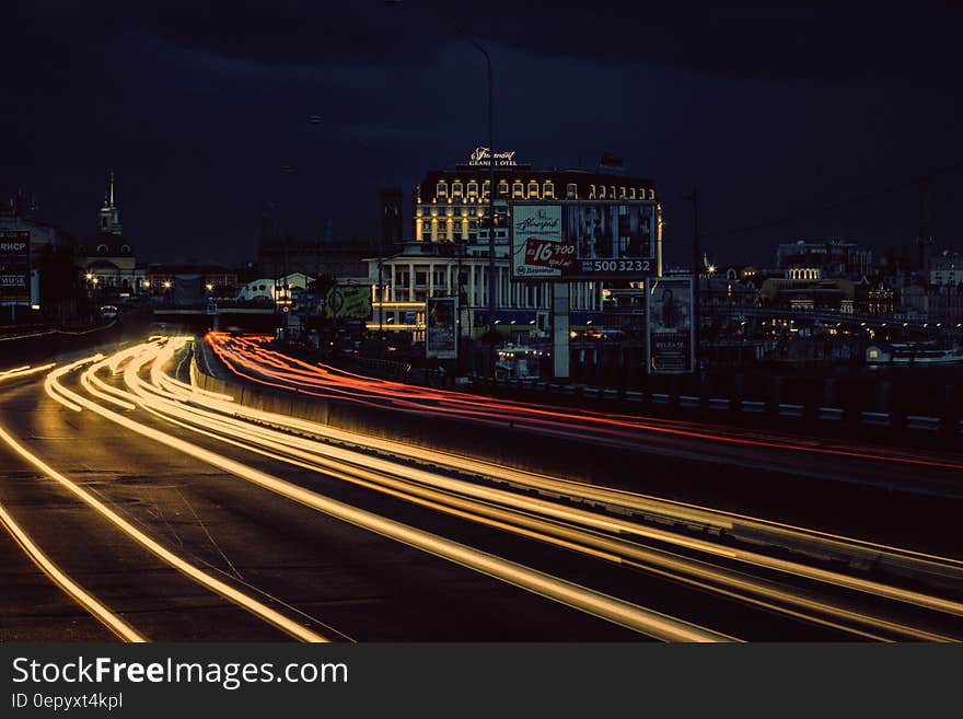 Timelapse Photography of Street With Vehicle Moving during Night Time