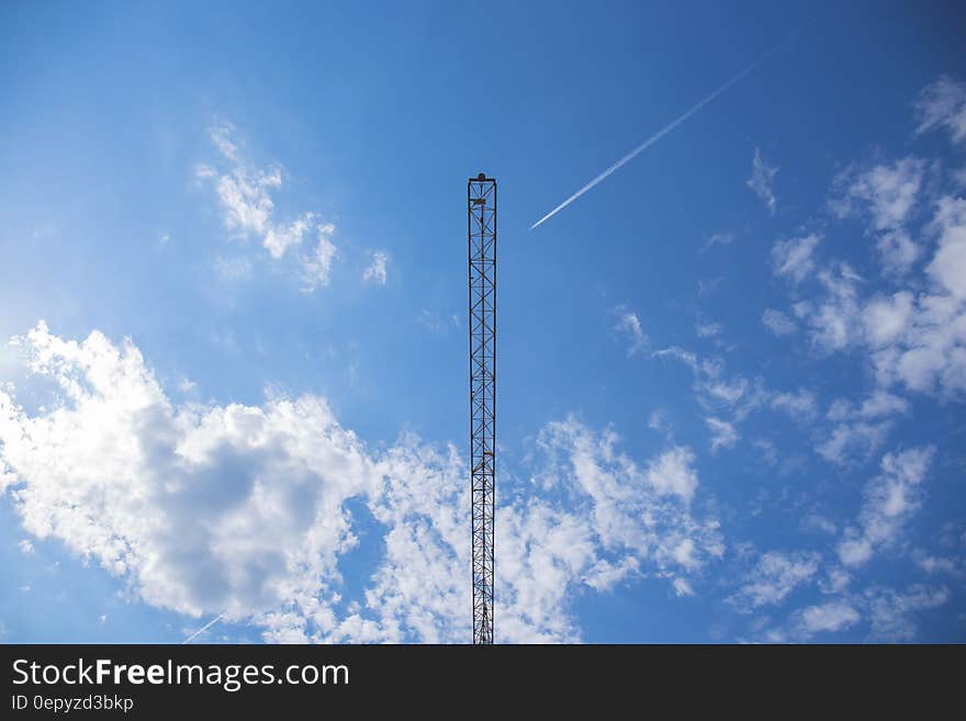 Black Tower Under Blue Sky during Daytime