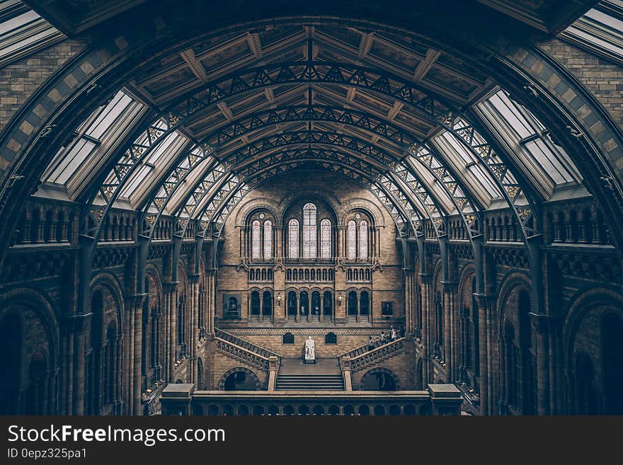 Arches and windows in vaulted ceiling over staircase of museum in London, England. Arches and windows in vaulted ceiling over staircase of museum in London, England.