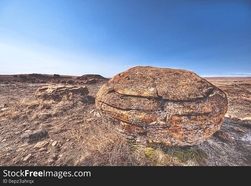 An arid landscape with rocks and blue skies.